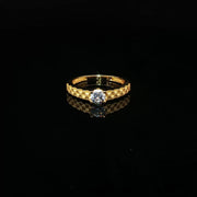 A classic solitaire, elevated in 22K gold