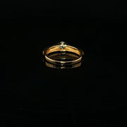 A classic solitaire, elevated in 22K gold