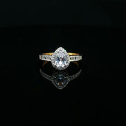 Elegant 22K Gold Pear-Cut CZ Ring with Baguette Details
