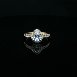 Elegant 22K Gold Pear-Cut CZ Ring with Baguette Details