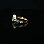 Elegant 22K Gold Pear-Cut CZ Ring with Baguette Details