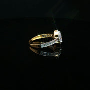 Elegant 22K Gold Pear-Cut CZ Ring with Baguette Details